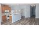 Open concept kitchen with stainless steel appliances and breakfast bar at 958 Shining Wire Way, Morrisville, NC 27560