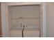 Closet laundry room features washer and dryer with a shelf at 958 Shining Wire Way, Morrisville, NC 27560