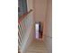 Carpeted stairs lead from the upper level to the front door, inviting guests into the home's warm and welcoming embrace at 958 Shining Wire Way, Morrisville, NC 27560