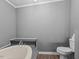 Modern bathroom featuring a soaking tub and white toilet at 1004 Candlewood Cir, Siler City, NC 27344