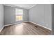 Bedroom features neutral paint, updated flooring, and natural light at 1004 Candlewood Cir, Siler City, NC 27344