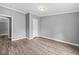 Bedroom featuring neutral paint, updated flooring, and neutral carpet at 1004 Candlewood Cir, Siler City, NC 27344