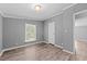 Bedroom features neutral paint, updated flooring, and natural light at 1004 Candlewood Cir, Siler City, NC 27344