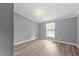 Bedroom featuring neutral paint, updated flooring, and natural light at 1004 Candlewood Cir, Siler City, NC 27344