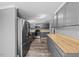 Modern kitchen with stainless steel appliances, sleek countertops, and ample cabinet space at 1004 Candlewood Cir, Siler City, NC 27344