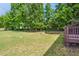 Lush backyard features a well-maintained lawn and privacy fence at 1009 Magnolia Leaf Ct, Apex, NC 27502