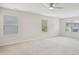 Spacious bedroom with plush carpeting, a ceiling fan, and lots of natural light at 1009 Magnolia Leaf Ct, Apex, NC 27502