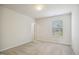 Bright bedroom with plush carpeting, neutral walls, and a window with natural light at 1009 Magnolia Leaf Ct, Apex, NC 27502
