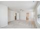 Large bedroom with a ceiling fan, neutral walls, and multiple entryways at 1009 Magnolia Leaf Ct, Apex, NC 27502