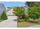 Charming two-story home with stone and siding, landscaped yard and two-car garage at 1009 Magnolia Leaf Ct, Apex, NC 27502