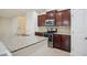 Modern kitchen featuring granite countertops, stainless steel appliances, and stainless oven at 1009 Magnolia Leaf Ct, Apex, NC 27502