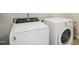 Well-equipped laundry room featuring a modern washer and dryer at 1009 Magnolia Leaf Ct, Apex, NC 27502
