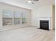 Spacious living room with neutral carpet, fireplace and large windows with blinds at 1009 Magnolia Leaf Ct, Apex, NC 27502