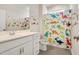 Charming bathroom featuring a vanity with storage and playful dinosaur-themed decor at 101 Rostova Way, Holly Springs, NC 27540