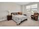 Bedroom featuring a cozy bed, a rocking chair, and a window at 101 Rostova Way, Holly Springs, NC 27540