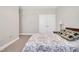 Comfortable bedroom features a bed with decorative pillows and a spacious closet at 101 Rostova Way, Holly Springs, NC 27540