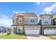 Charming two-story home boasts stone accents, a two-car garage, and a well-manicured lawn at 101 Rostova Way, Holly Springs, NC 27540