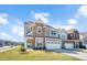 Charming two-story home boasts stone accents, a two-car garage, and a well-manicured lawn at 101 Rostova Way, Holly Springs, NC 27540