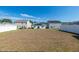 Backyard view showing neighboring homes and a grass lawn at 103 Norris Creek Dr, Clayton, NC 27527