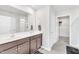 Bathroom with double sink vanity, framed mirror, and walk-in shower at 103 Norris Creek Dr, Clayton, NC 27527