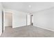A bedroom with an open door to a closet and another door to enter the room at 103 Norris Creek Dr, Clayton, NC 27527