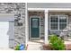 Close-up of the front door with stone veneer, house number, and welcoming entrance at 103 Norris Creek Dr, Clayton, NC 27527