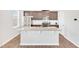 Modern kitchen island with granite countertops and stainless-steel appliances at 103 Norris Creek Dr, Clayton, NC 27527