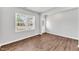 Inviting living room with hardwood floors, a bright window, and a view to the outside at 103 Norris Creek Dr, Clayton, NC 27527