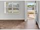 Bright living room featuring hardwood floors and a view of the neighborhood through a large window at 103 Norris Creek Dr, Clayton, NC 27527