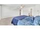 Bedroom with ceiling fan, ensuite bathroom, and walk-in closet access at 103 Norris Creek Dr, Clayton, NC 27527