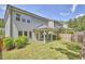 Spacious backyard with a covered patio offering an inviting space for entertainment and relaxation at 120 Chapel Run Way, Chapel Hill, NC 27517