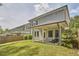Charming home featuring a covered patio and green backyard space, perfect for relaxation and outdoor enjoyment at 120 Chapel Run Way, Chapel Hill, NC 27517