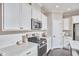 Well-equipped kitchen featuring stainless steel appliances, including a microwave and gas range at 120 Chapel Run Way, Chapel Hill, NC 27517