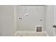 A white laundry room featuring appliance hookups and a tiled floor at 120 Chapel Run Way, Chapel Hill, NC 27517