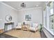 Cozy living area with neutral walls, large windows, and stylish decor, perfect for relaxing and entertaining at 120 Chapel Run Way, Chapel Hill, NC 27517