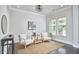 Bright living area featuring neutral walls, large windows, and comfortable seating, ideal for gatherings at 120 Chapel Run Way, Chapel Hill, NC 27517