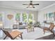 Comfortable living area with neutral walls, large windows, and stylish furnishings, ideal for relaxation at 120 Chapel Run Way, Chapel Hill, NC 27517