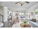 Open-concept living room with dark hardwood floors, modern furnishings, and an abundance of natural light at 120 Chapel Run Way, Chapel Hill, NC 27517