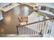 Open-concept living room view from the staircase with stylish seating and hardwood floors at 120 Chapel Run Way, Chapel Hill, NC 27517