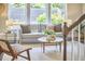 Inviting living room featuring large windows, neutral walls, and comfortable seating, perfect for relaxation at 120 Chapel Run Way, Chapel Hill, NC 27517