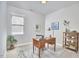 Bright, inviting office featuring a desk and chair set on a stylish rug, with a window and neutral decor at 120 Chapel Run Way, Chapel Hill, NC 27517