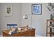 A close up of the office space, showing the wooden desk, chair, and décor at 120 Chapel Run Way, Chapel Hill, NC 27517