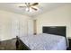 Comfortable bedroom featuring a ceiling fan, closet, and doorway to another room at 121 Martingale Dr, Holly Springs, NC 27540