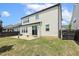 Charming home featuring a spacious backyard and patio area at 121 Martingale Dr, Holly Springs, NC 27540