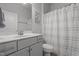 A clean bathroom featuring a single vanity with a neutral color scheme at 124 Boomer St, Benson, NC 27504