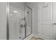 Modern shower with a glass door and built-in shelving at 124 Boomer St, Benson, NC 27504