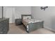 Cozy bedroom with patterned bedding and natural light at 124 Boomer St, Benson, NC 27504