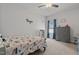 Bright bedroom featuring themed bedding and a large window at 124 Boomer St, Benson, NC 27504