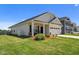 Charming home with a well-manicured lawn, inviting porch, and a two-car garage at 124 Boomer St, Benson, NC 27504