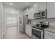Well-equipped kitchen with stainless steel appliances and ample counter space at 124 Boomer St, Benson, NC 27504